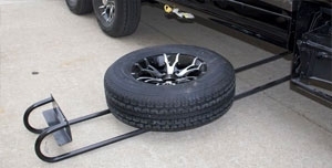 How wide of a tire will fit when mounted on a trailer with enclosed underbelly?  My tire is approx. 10" wide.